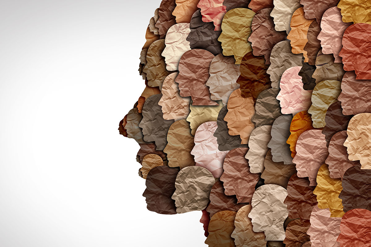 A silhouette of a face is filled with multiple silhouettes of varying colours and tones representing diversity.