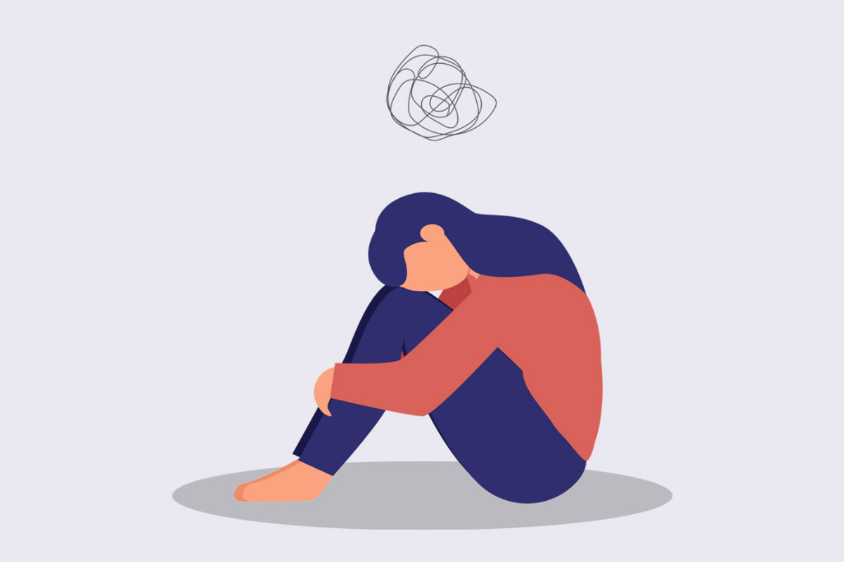 An illustration of a woman sat on the floor looking depressed.