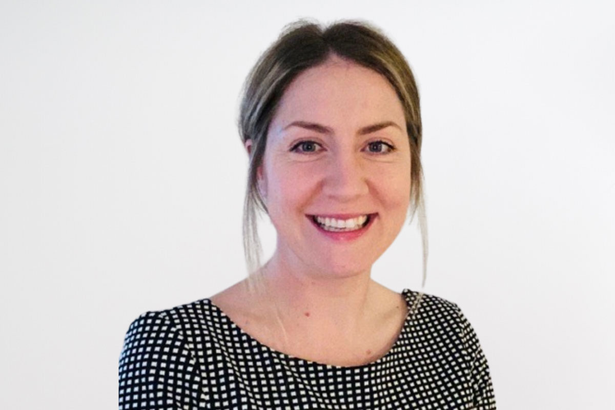 A headshot of Nicola Jagielski, Clinical Director at PAM Wellbeing wearing a polka dot black and white top